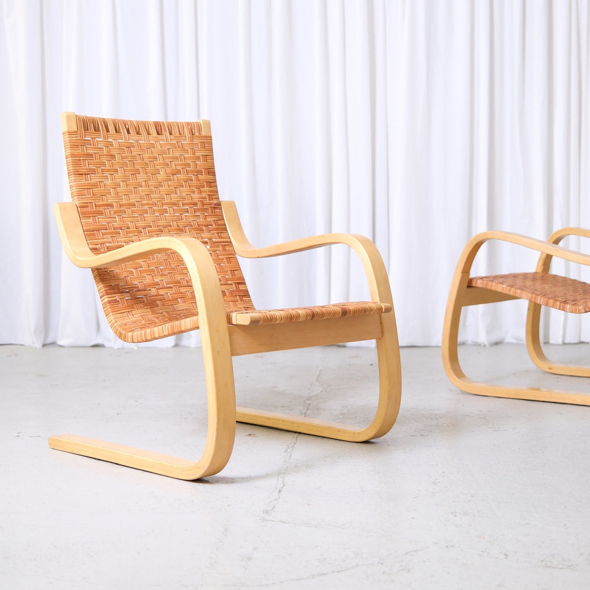 alvar-aalto-406-rattan-lounge-chairs-artek