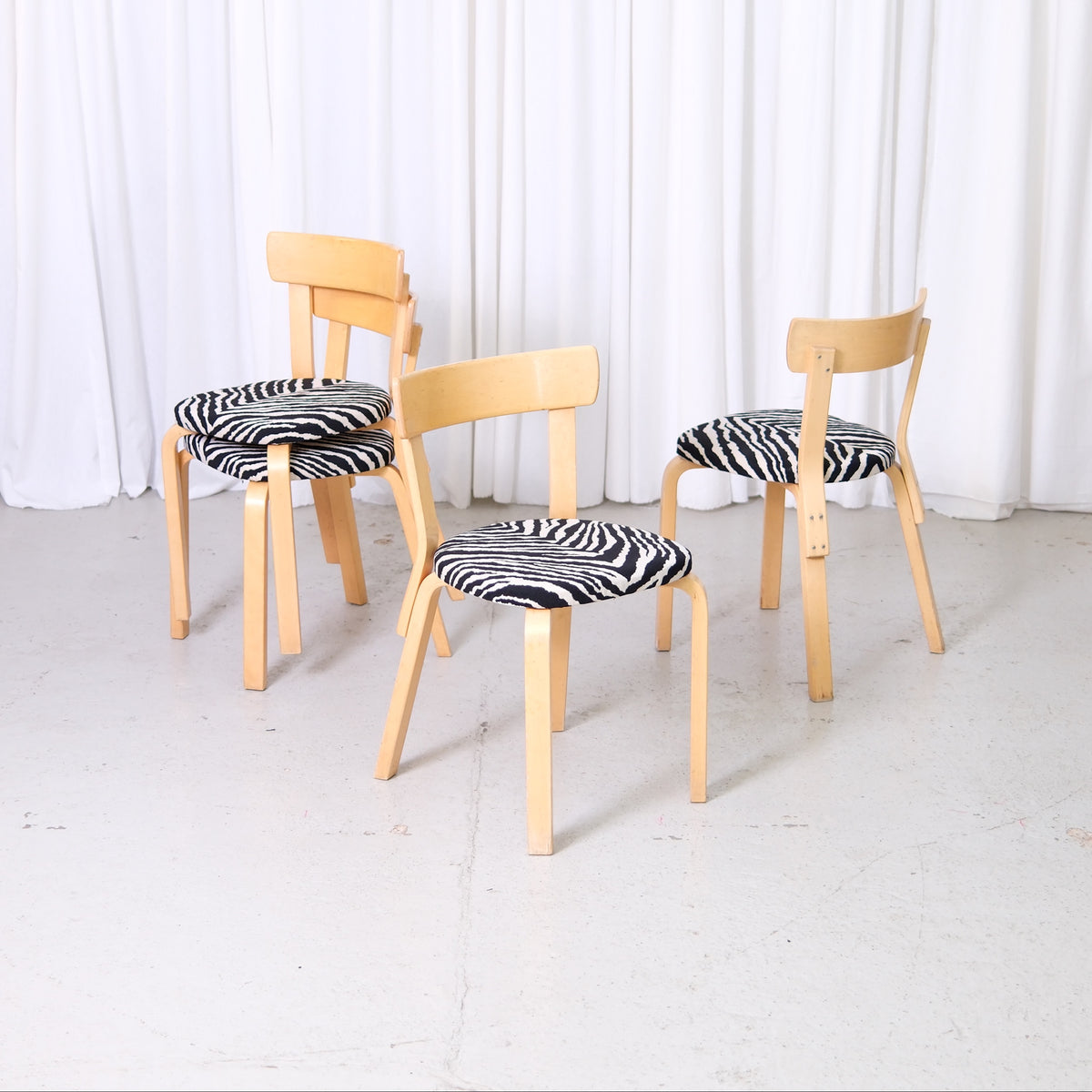 Artek Chair 69 by Alvar Aalto with birch frame and zebra-patterned upholstery, vintage Finnish design dining chair.