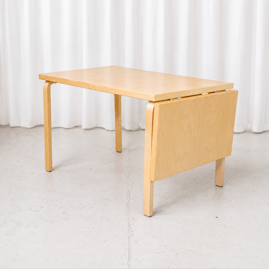 Classic Artek drop-leaf table by Alvar Aalto with a practical extendable design.
