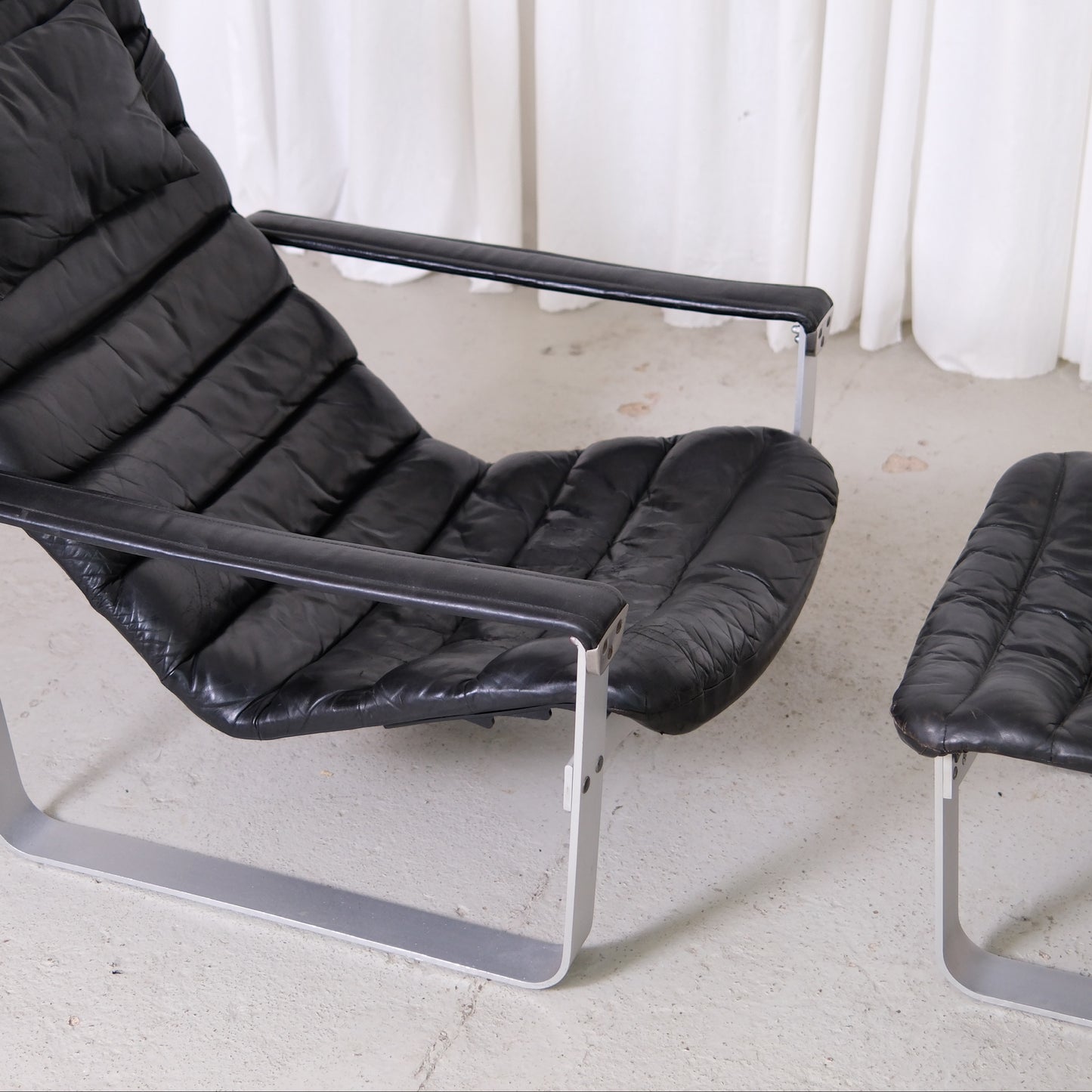 Ilmari Lappalainen Pulkka Lounge Chair and Ottoman in Black Leather, Asko Export