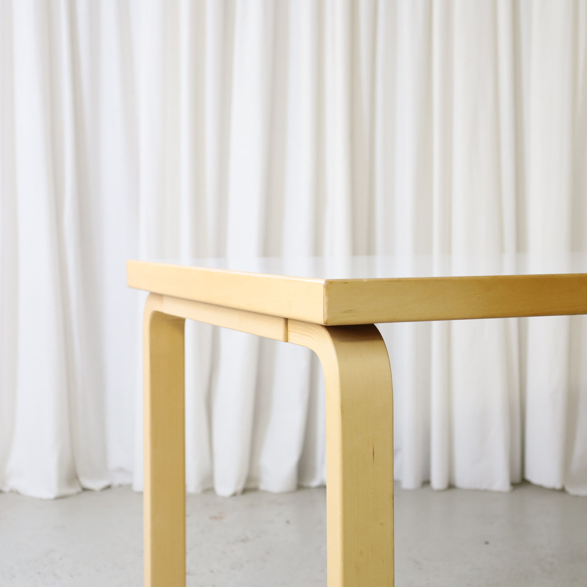 Corner and birch leg detail of Artek dining table