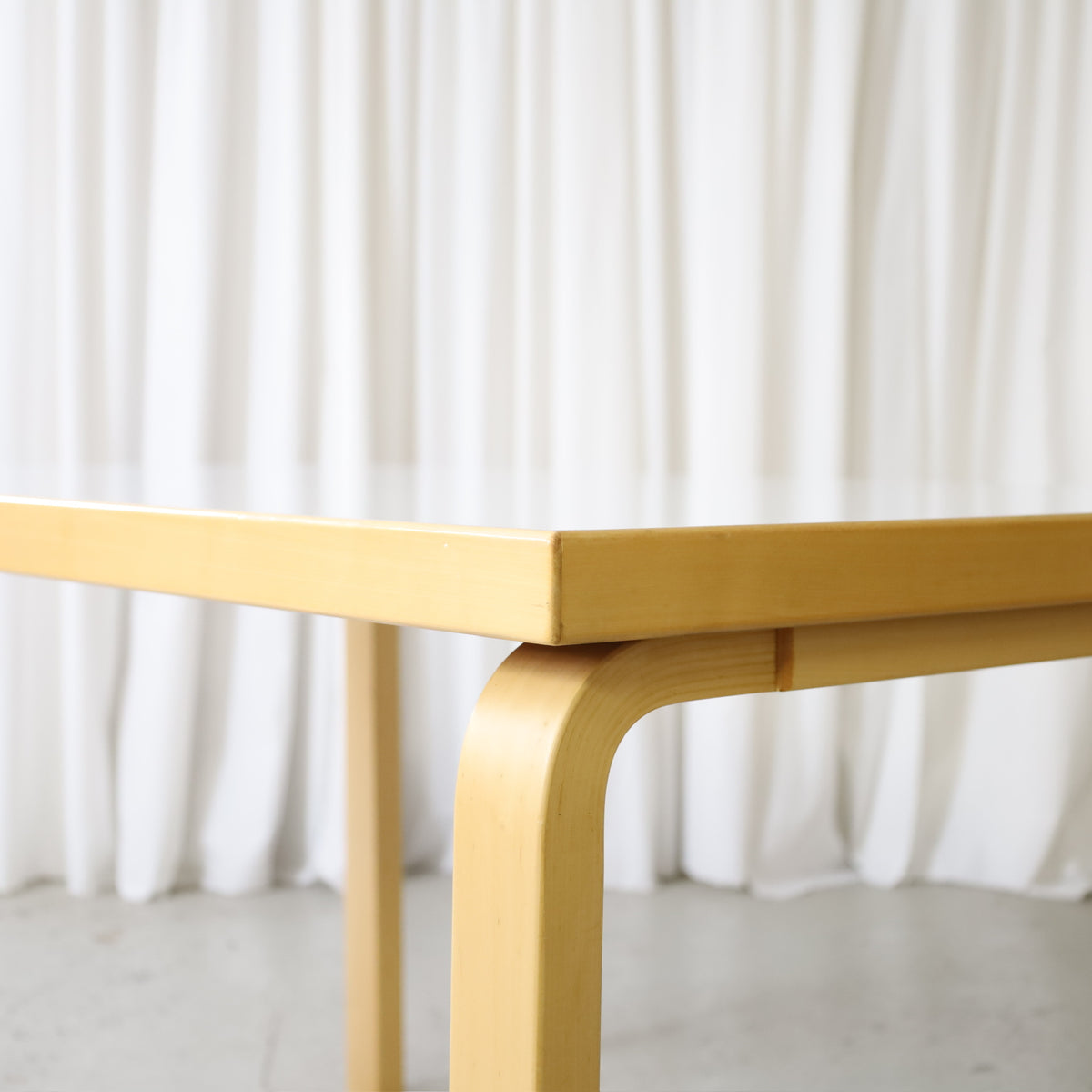 Detail of bent birch L-leg on Alvar Aalto table