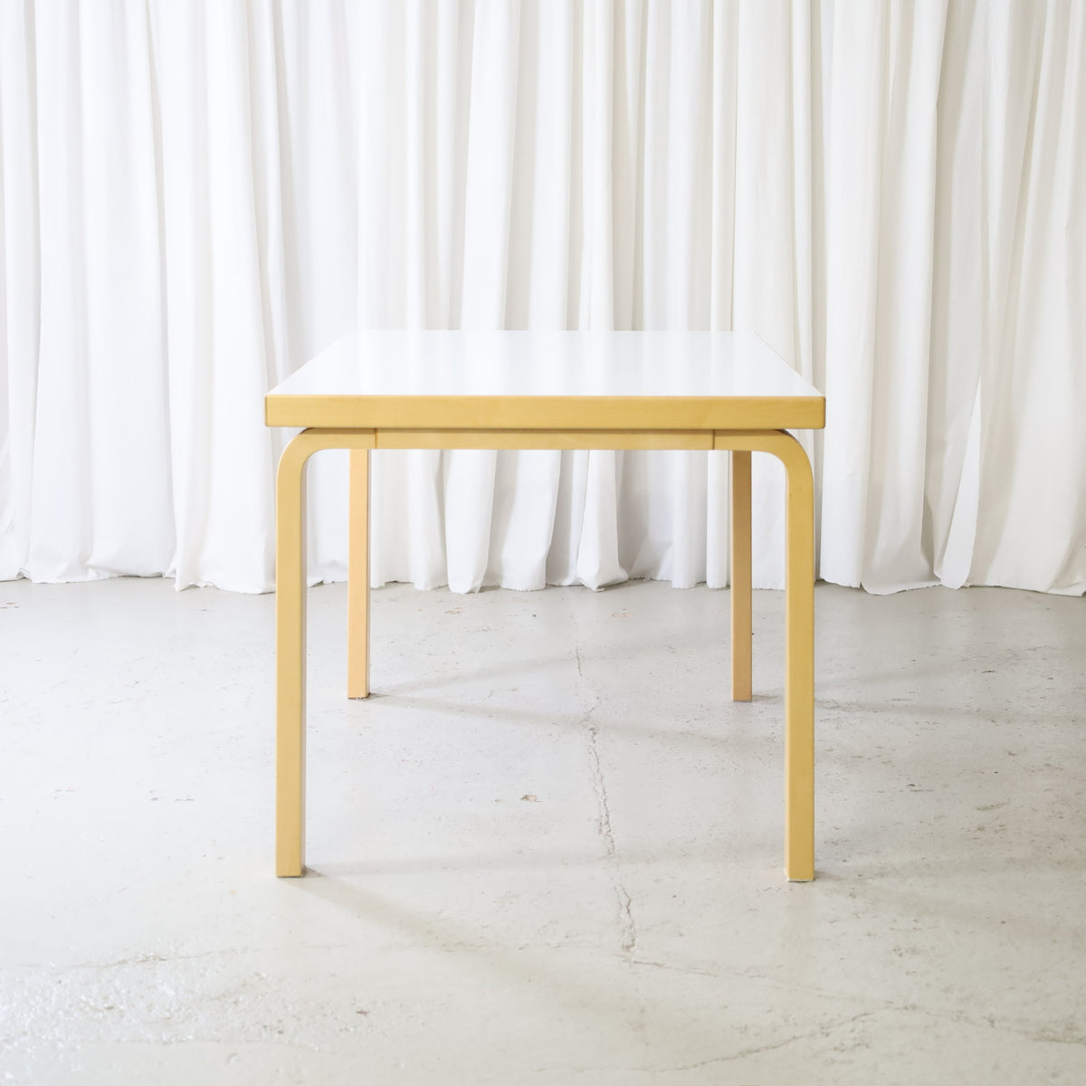 Artek dining table by Alvar Aalto, end view
