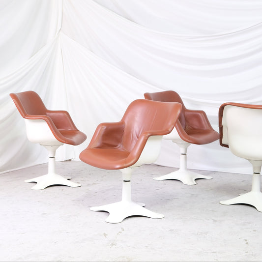 Set of four vintage Yrjö Kukkapuro Junior chairs by Haimi with cognac upholstery and white swivel bases