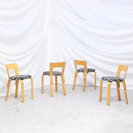 Rare vintage Artek A65 chairs from the 1940s to 1950s with beautiful patina and zebra upholstery. A hard-to-find Finnish design set.