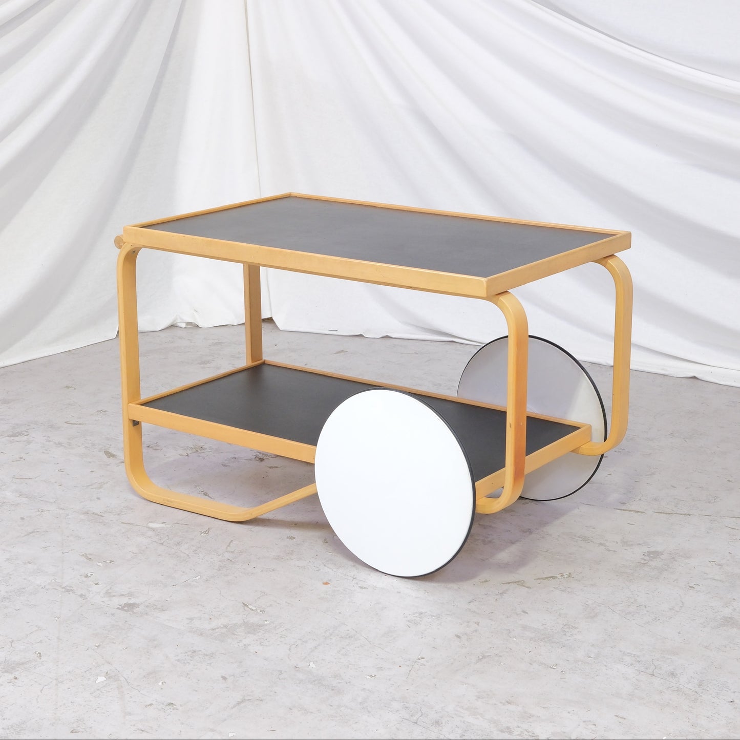 Vintage Alvar Aalto 901 tea trolley with black linoleum shelves and birch bentwood frame