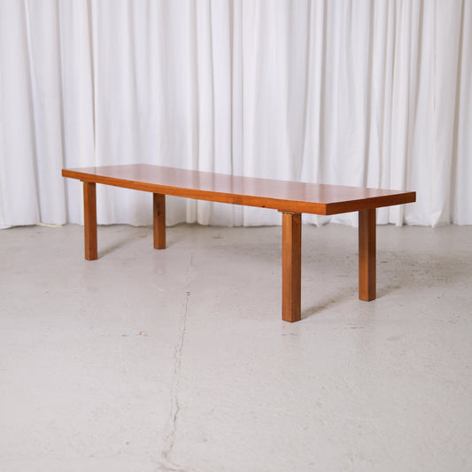 Vintage Japandi style teak coffee table with minimalist Scandinavian design photographed in studio.