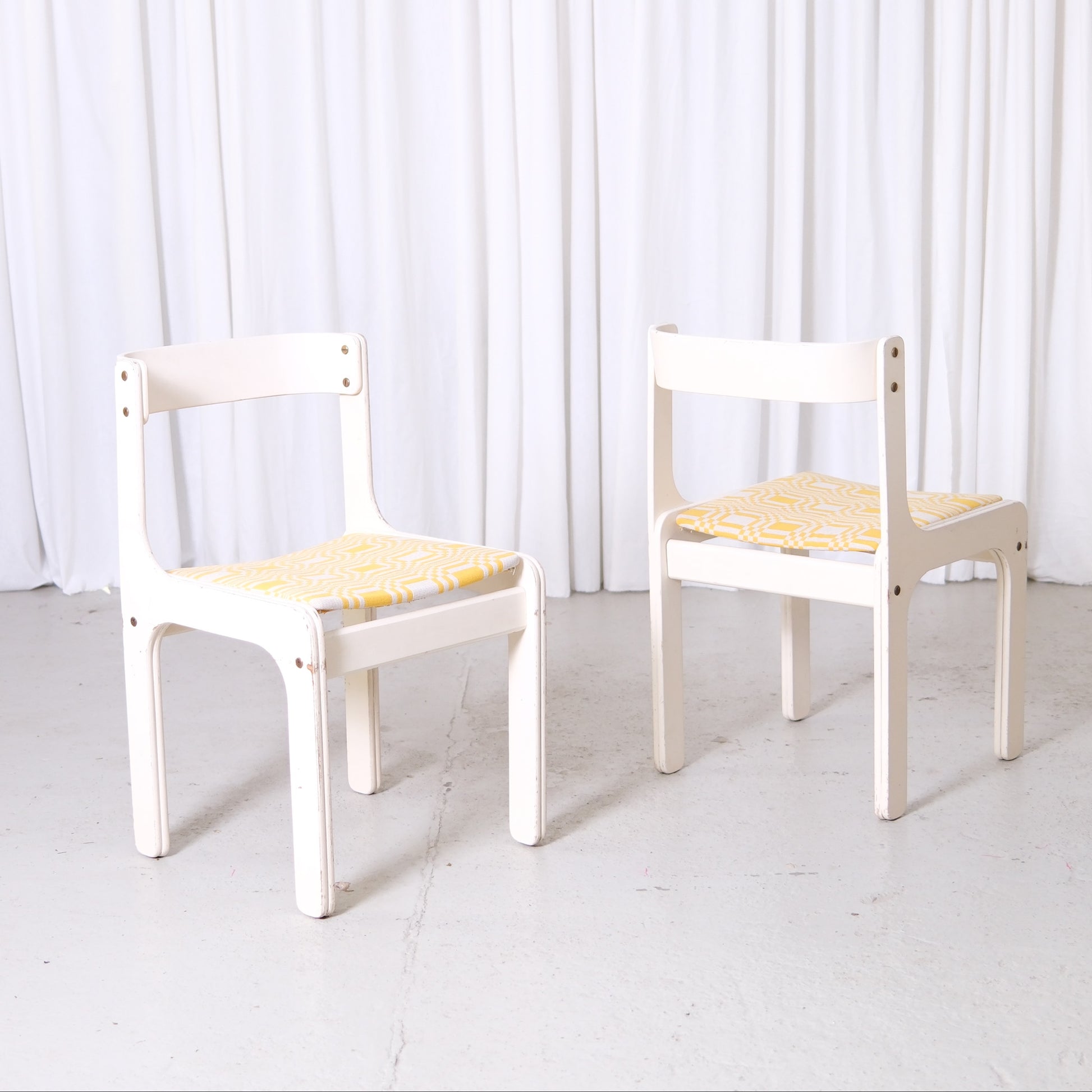 Vintage Kristian Gullichsen chair with white painted frame and newly upholstered yellow patterned seat in yellow fabric
