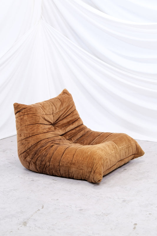 Vintage Togo fireside chair by Michel Ducaroy for Ligne Roset. Brown velvet upholstery with patina. Authentic 1970s lounge chair. Worldwide shipping available.