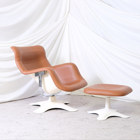 Vintage Yrjö Kukkapuro Karuselli chair with ottoman, manufactured by Haimi. White fiberglass frame with newly reupholstered brown leather. Worldwide shipping available.