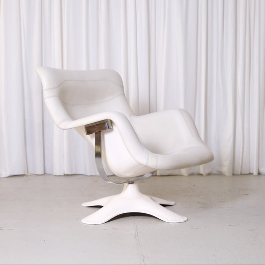 Yrjö Kukkapuro Karuselli lounge chair by Avarte with white leather upholstery, glossy white frame, and chrome metal details.