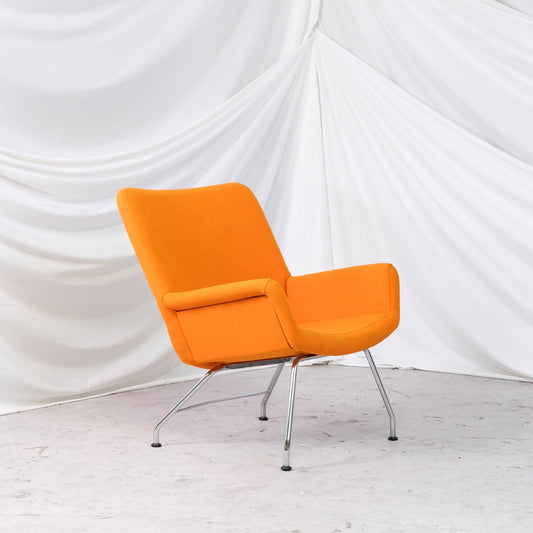 Moderno L-23 chair by Yrjö Kukkapuro for Lepo Product Oy in orange fabric with chrome base. A bold Finnish design chair from the 2020s.
