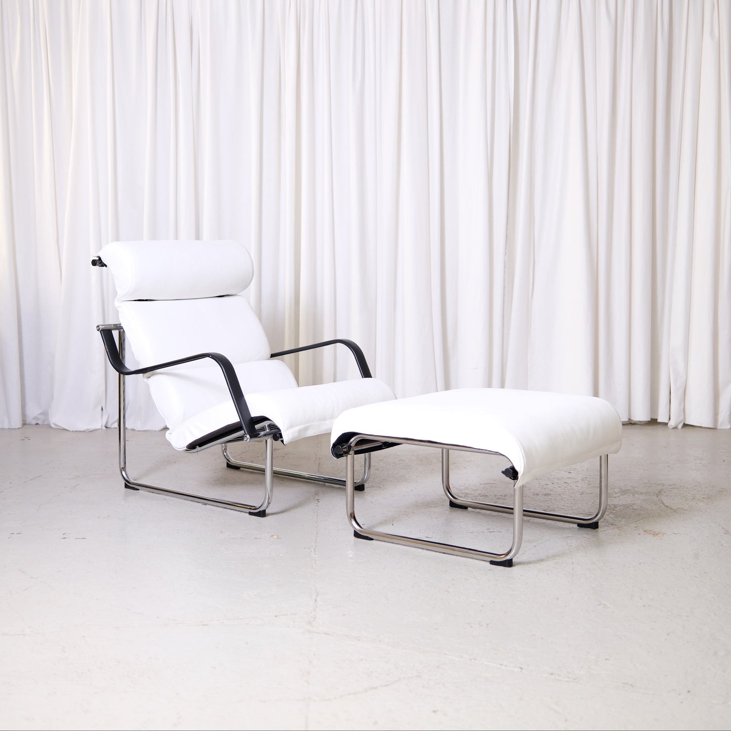Yrjö Kukkapuro Remmi lounge chair and ottoman in white leather with chrome frame
