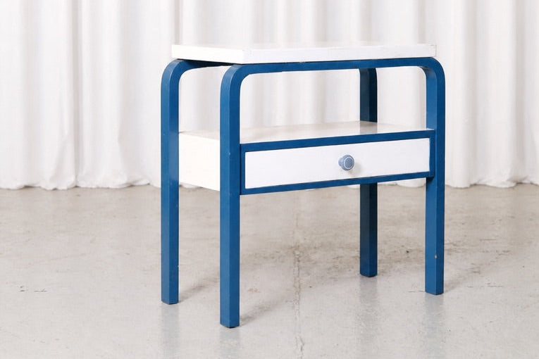 Blue and white Artek side table with drawer, front view