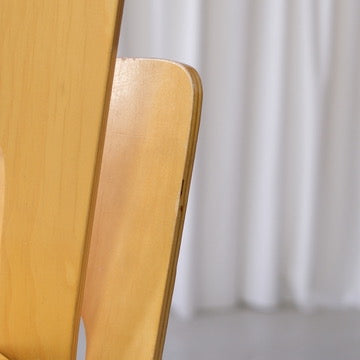 Close-up of age-related wear along the edge of an Artek Chair 66 backrest