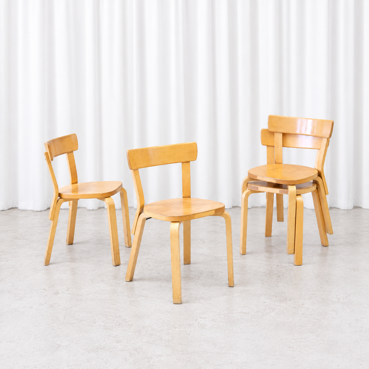 Four vintage Artek Chair 69 chairs in birch, including a stacked pair
