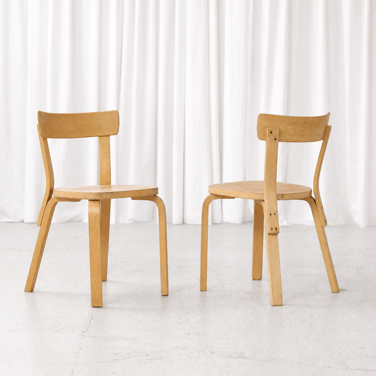 Front and rear views of 1950s Artek Chair 69 chairs