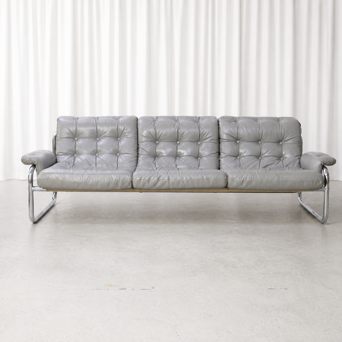 Front view of grey leather IKEA Borkum three-seater sofa