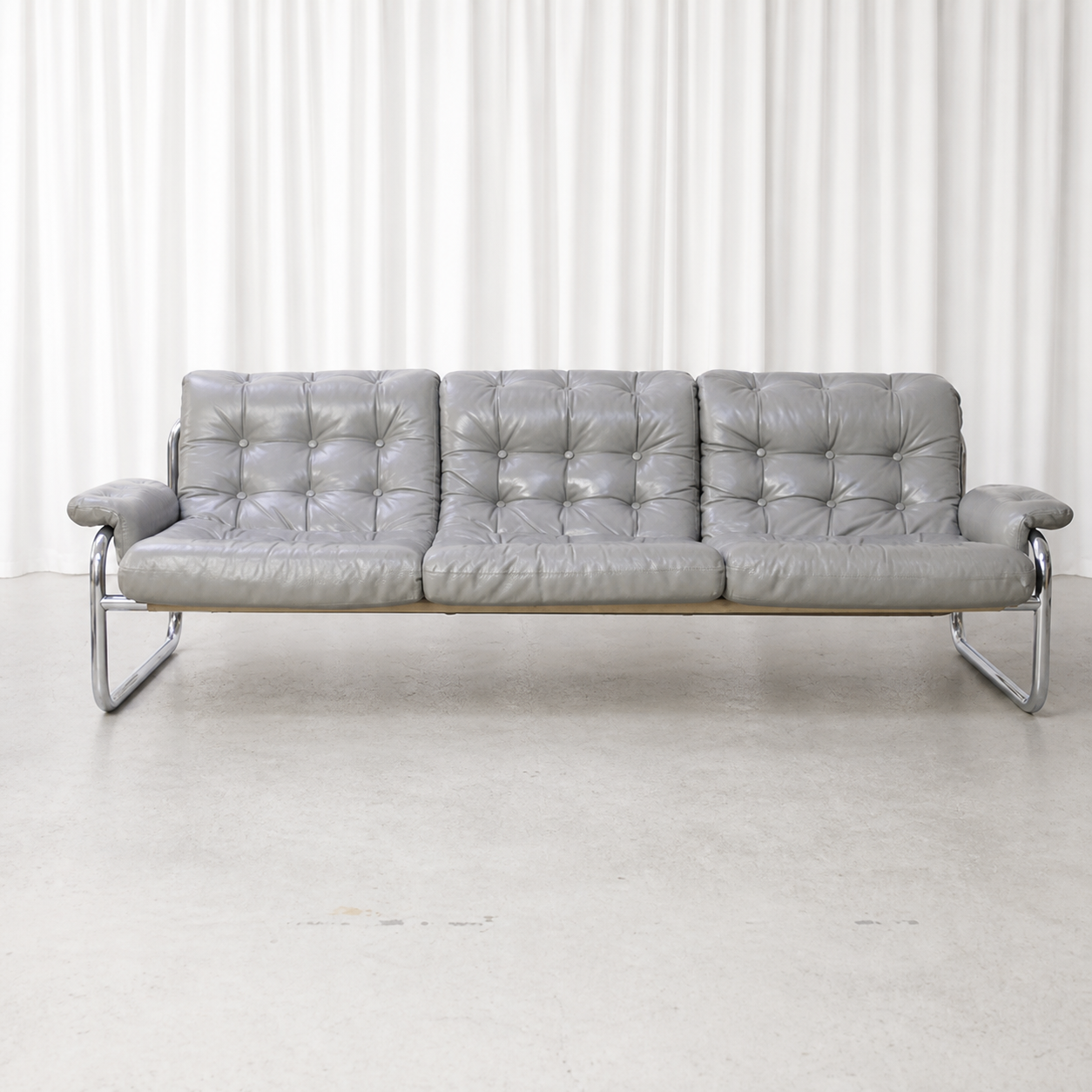 Front view of grey leather IKEA Borkum three-seater sofa