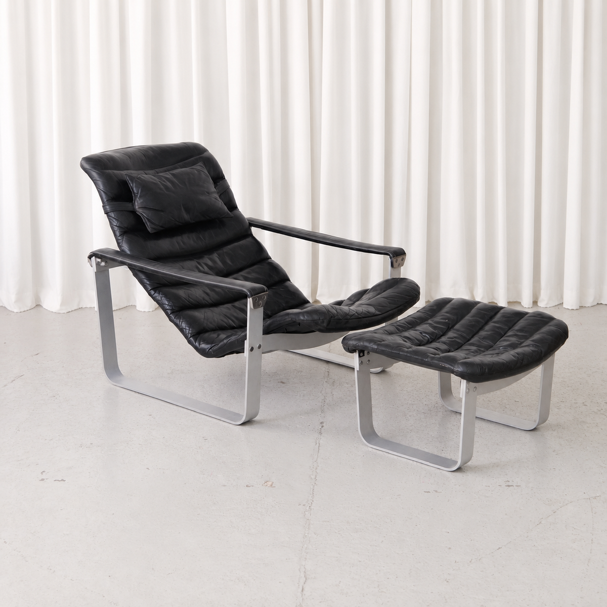 Ilmari Lappalainen Pulkka Lounge Chair and Ottoman in Black Leather, Asko Export