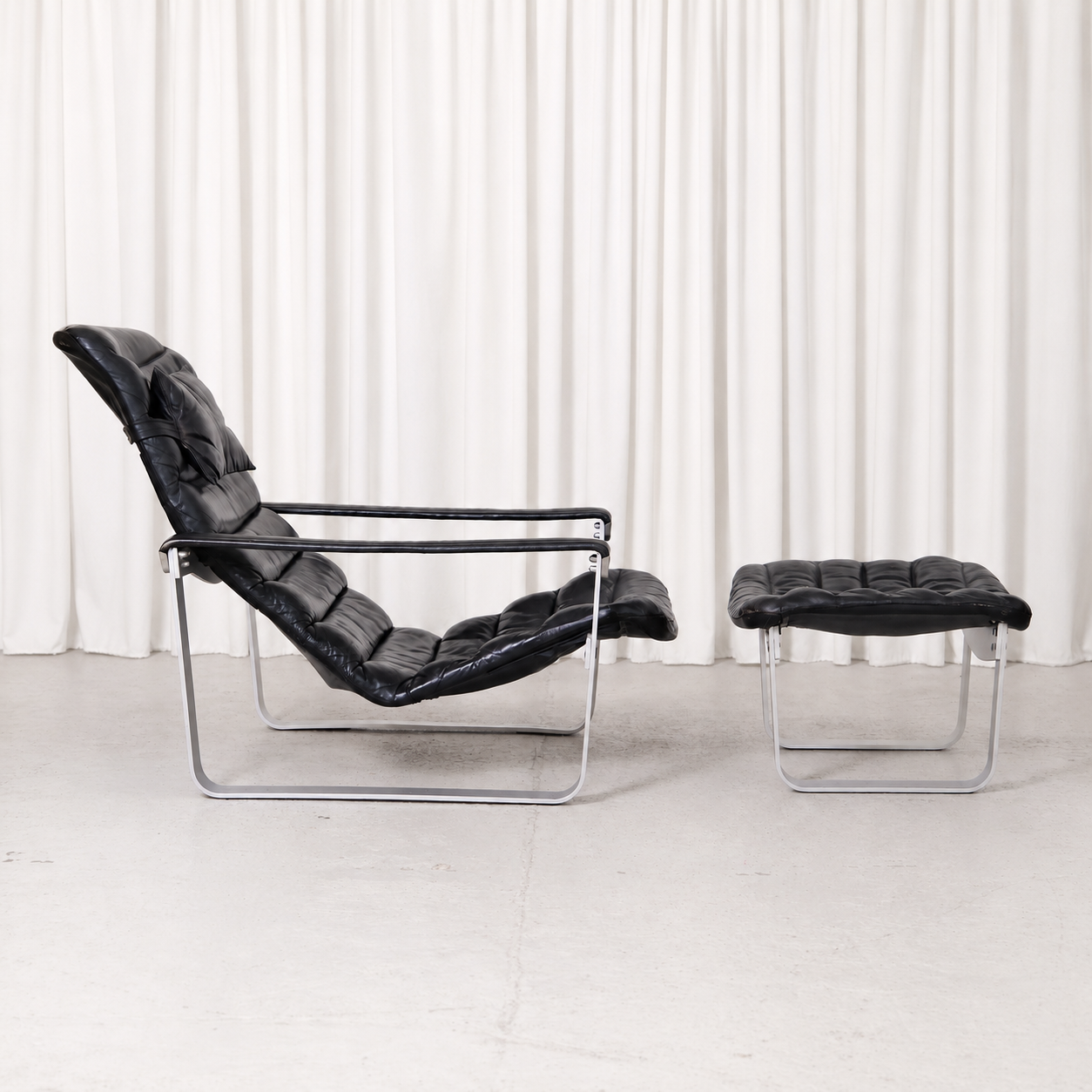 Ilmari Lappalainen Pulkka Lounge Chair and Ottoman in Black Leather, Asko Export