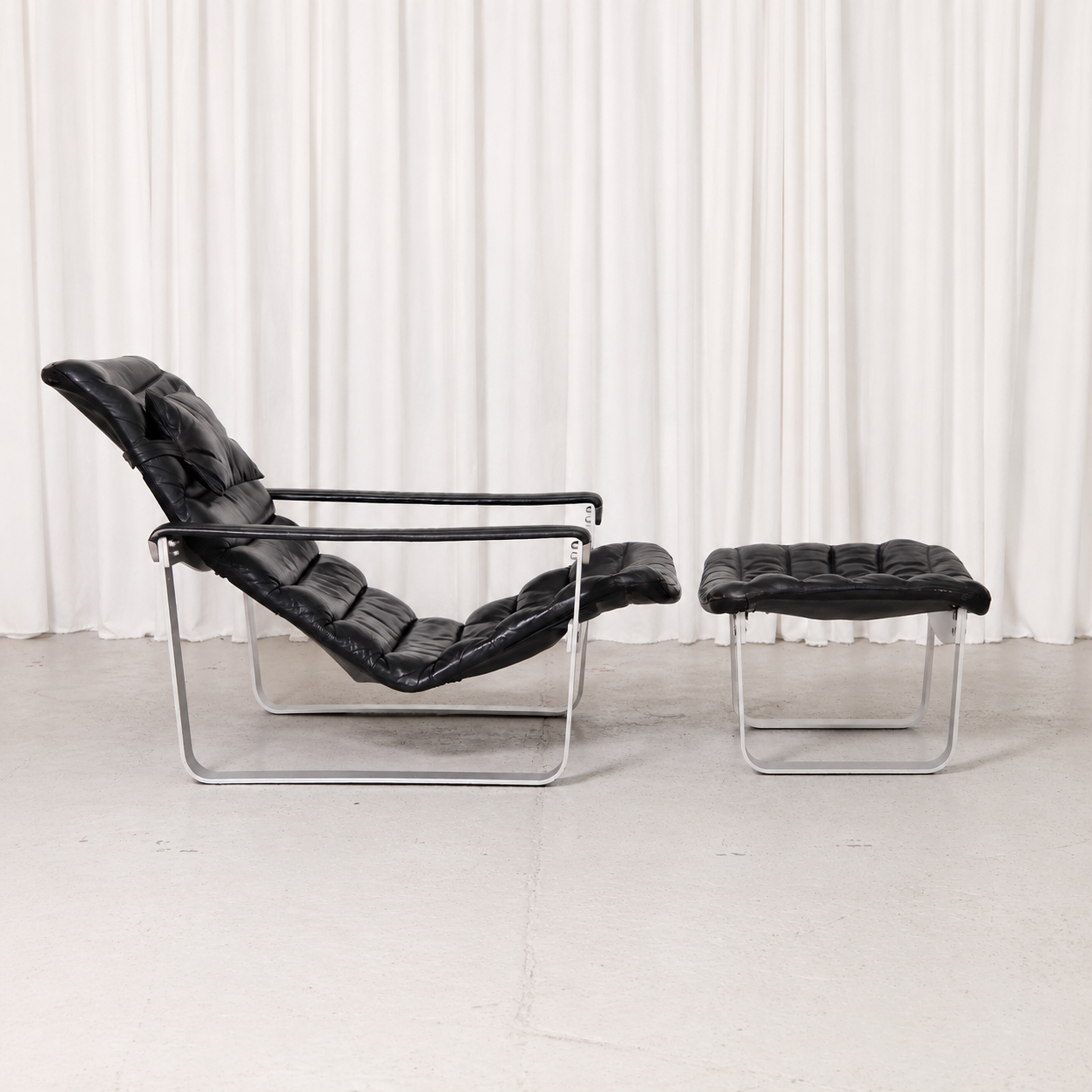 Ilmari Lappalainen Pulkka Lounge Chair and Ottoman in Black Leather, Asko Export