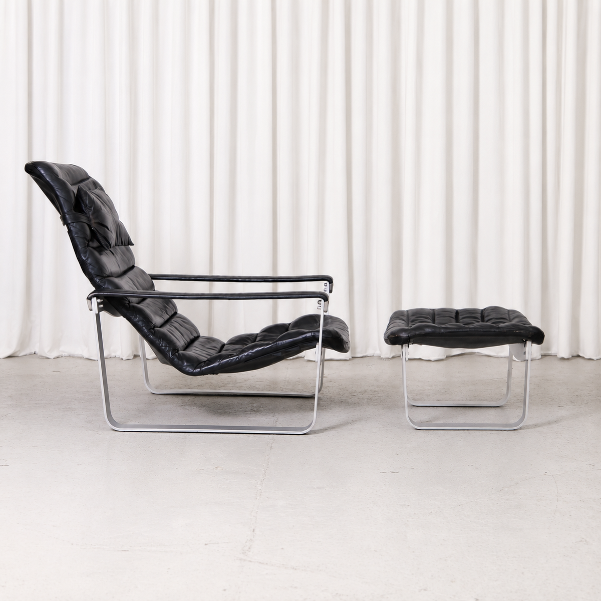 Ilmari Lappalainen Pulkka Lounge Chair and Ottoman in Black Leather, Asko Export