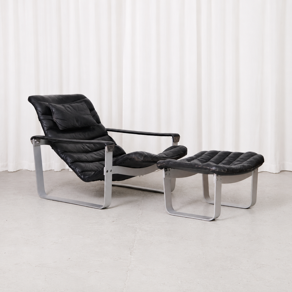 Ilmari Lappalainen Pulkka Lounge Chair and Ottoman in Black Leather, Asko Export