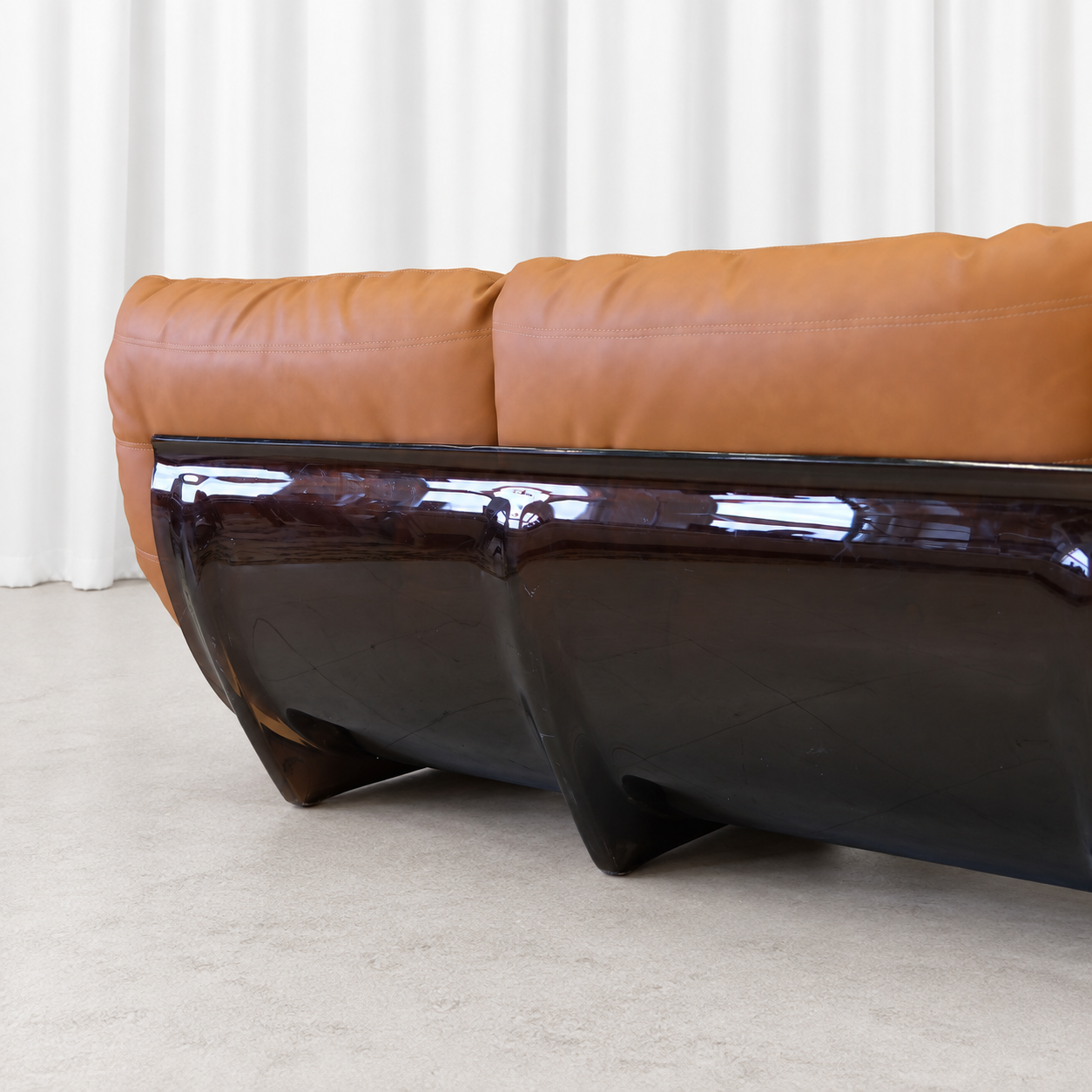 Ligne Roset Marsala sofa smoked acrylic shell and leather upholstery, left detail.