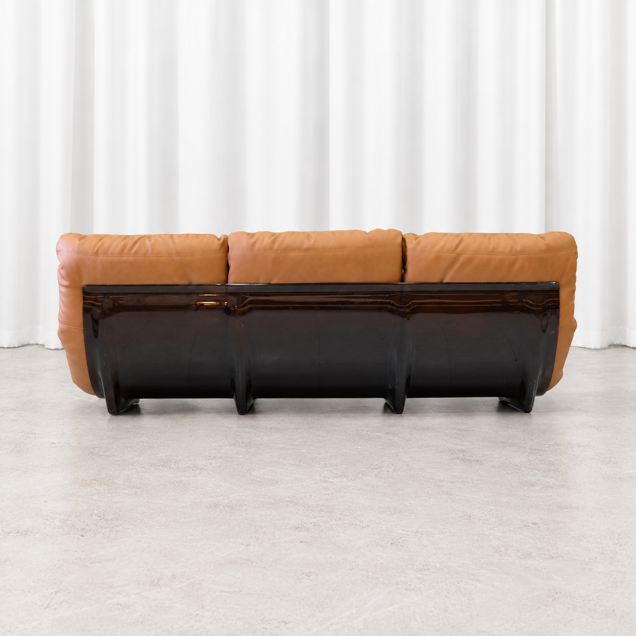 Ligne Roset Marsala three-seater sofa with smoked acrylic shell, rear view.