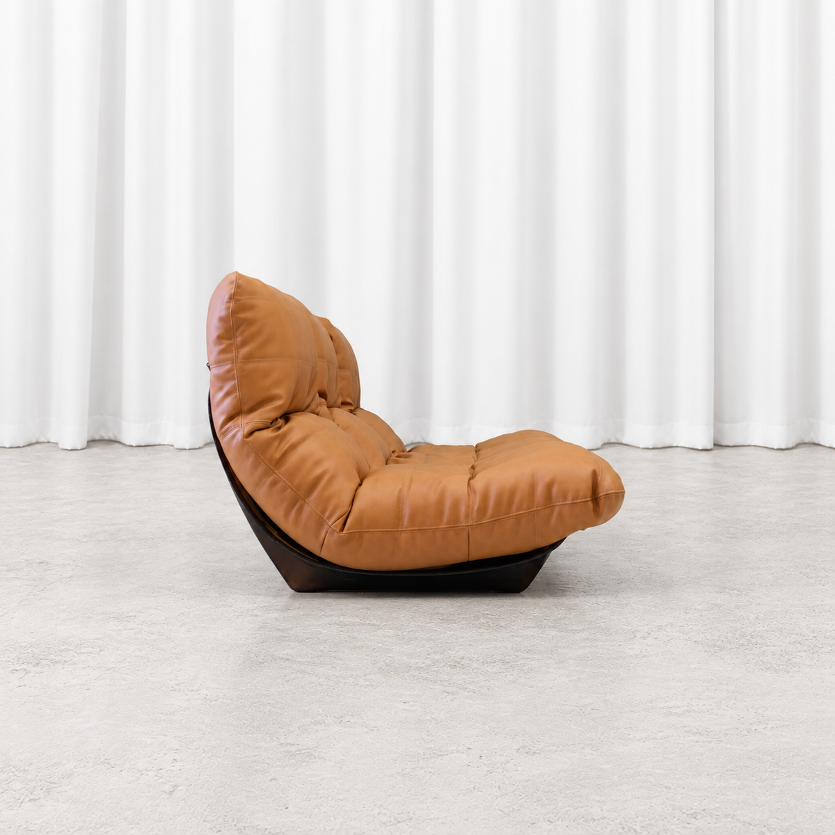 Ligne Roset Marsala three-seater sofa in cognac leather, side profile.