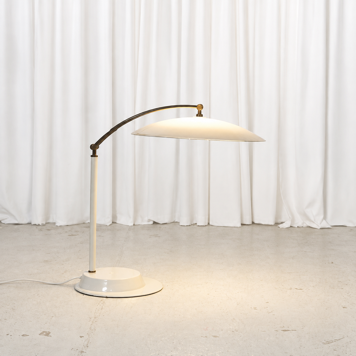 Vintage adjustable table lamp with white acrylic shade and brass arm