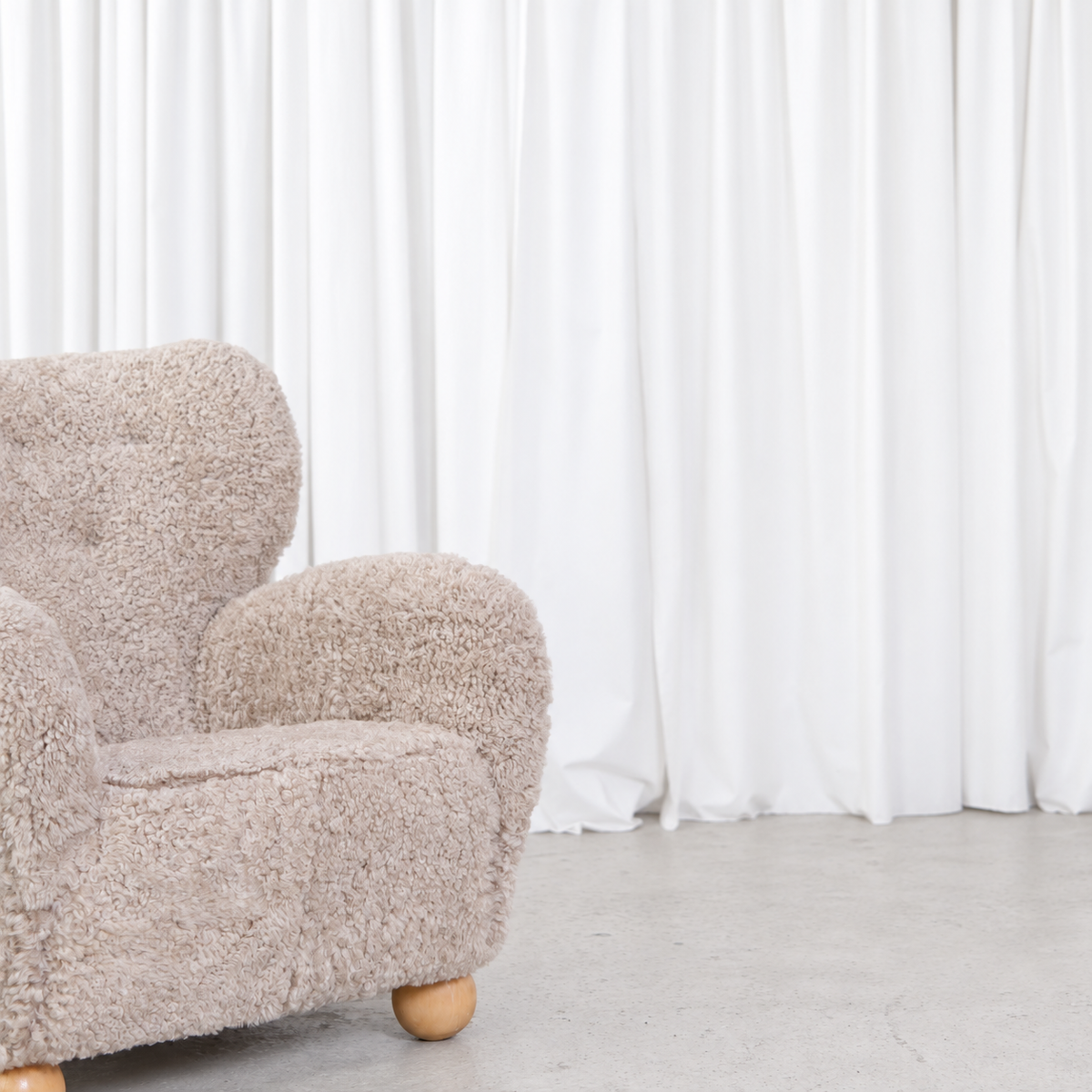 Vintage Danish sheepskin armchair, seat and arm detail