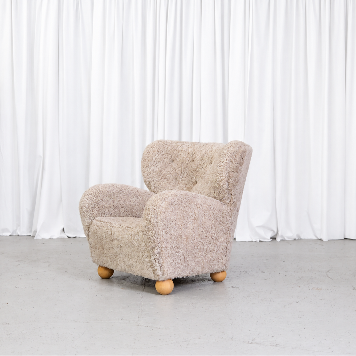 Vintage Danish sheepskin armchair, front angle