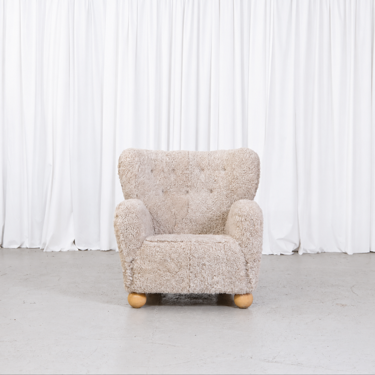 Vintage Danish sheepskin armchair, front view