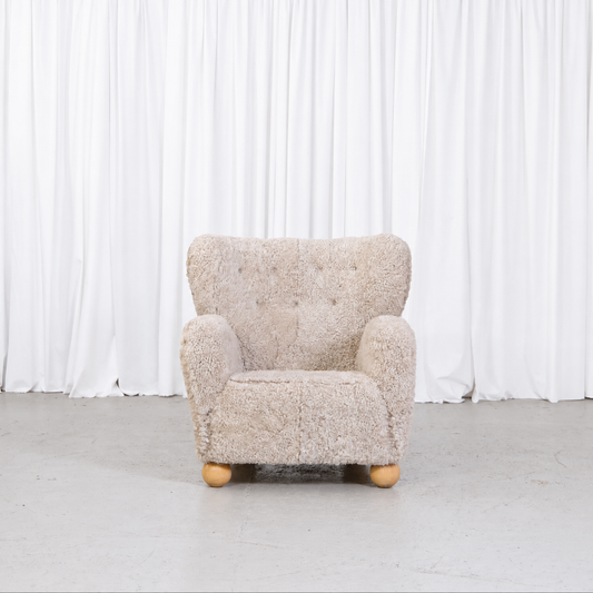 Vintage Danish sheepskin armchair, front view