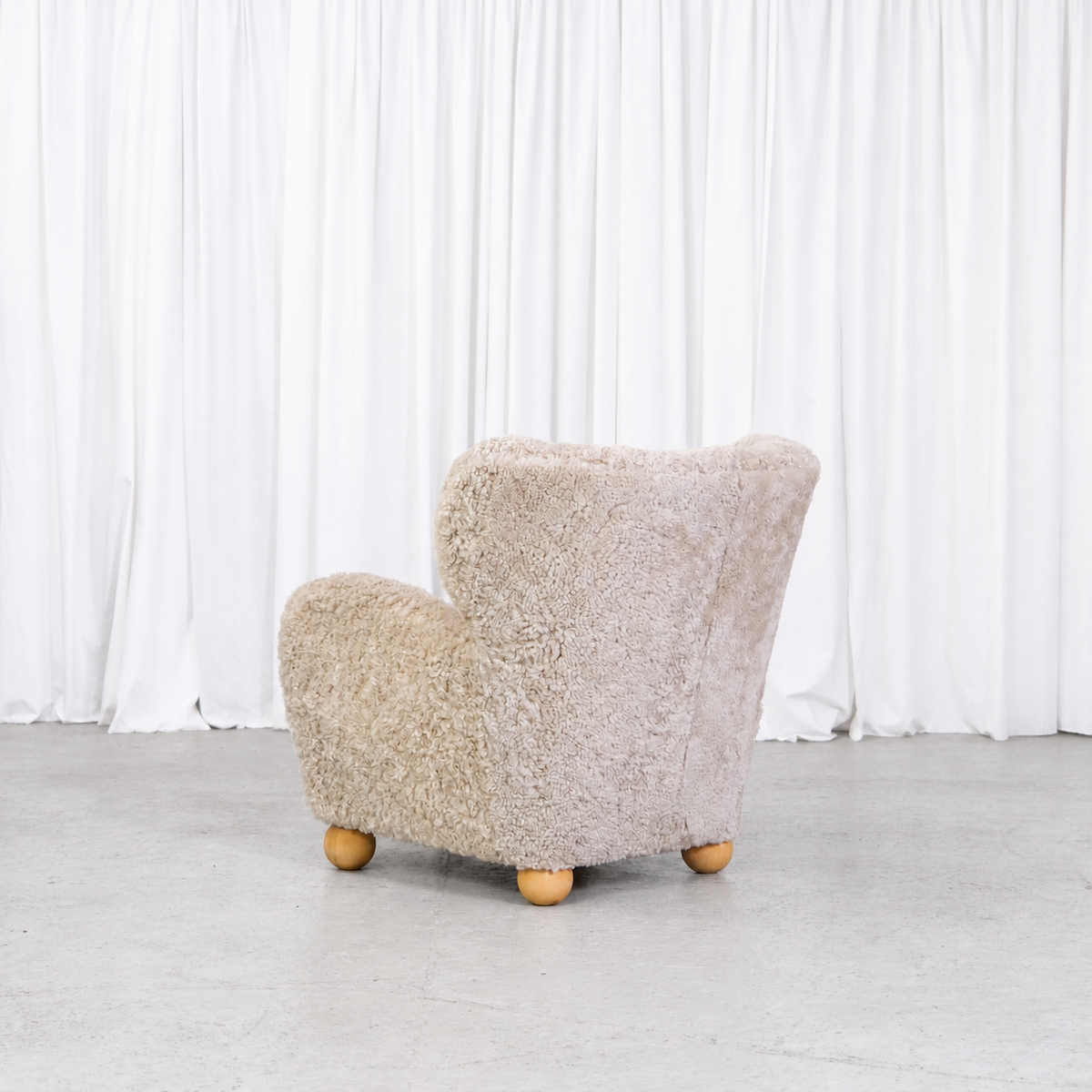 Vintage Danish sheepskin armchair, rear angle