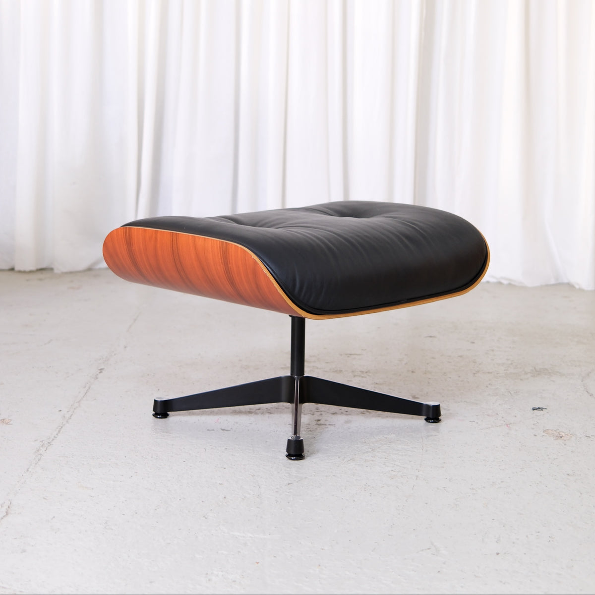 Vitra Eames Ottoman in Santos palisander and black Premium F leather