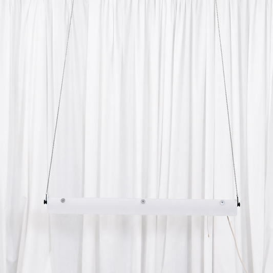 Full view of the white SLO-Metal Oy pendant light suspended from metal chains